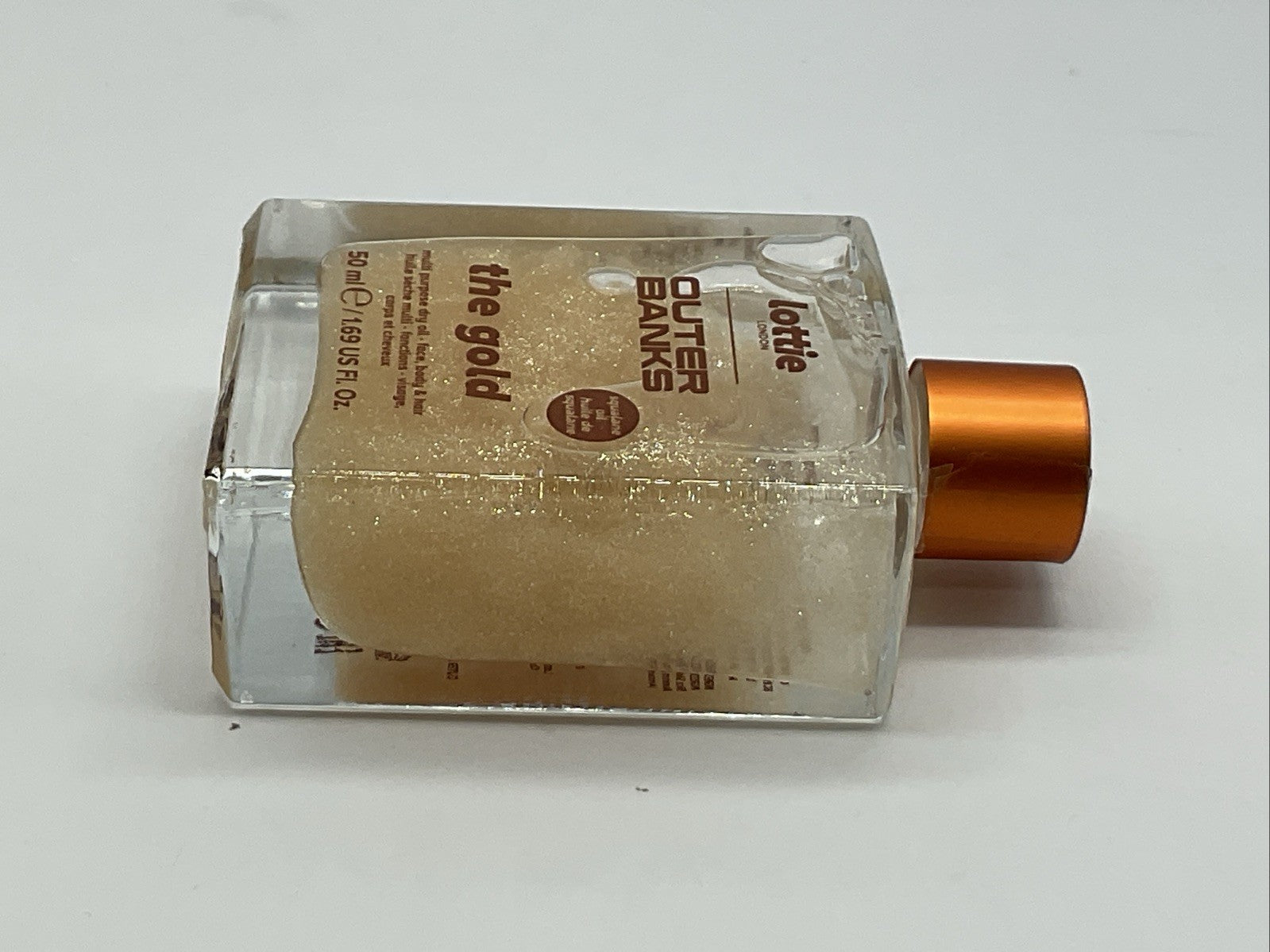 Lottie London X Outer Banks Body Illuminating Dry Oil - The Gold