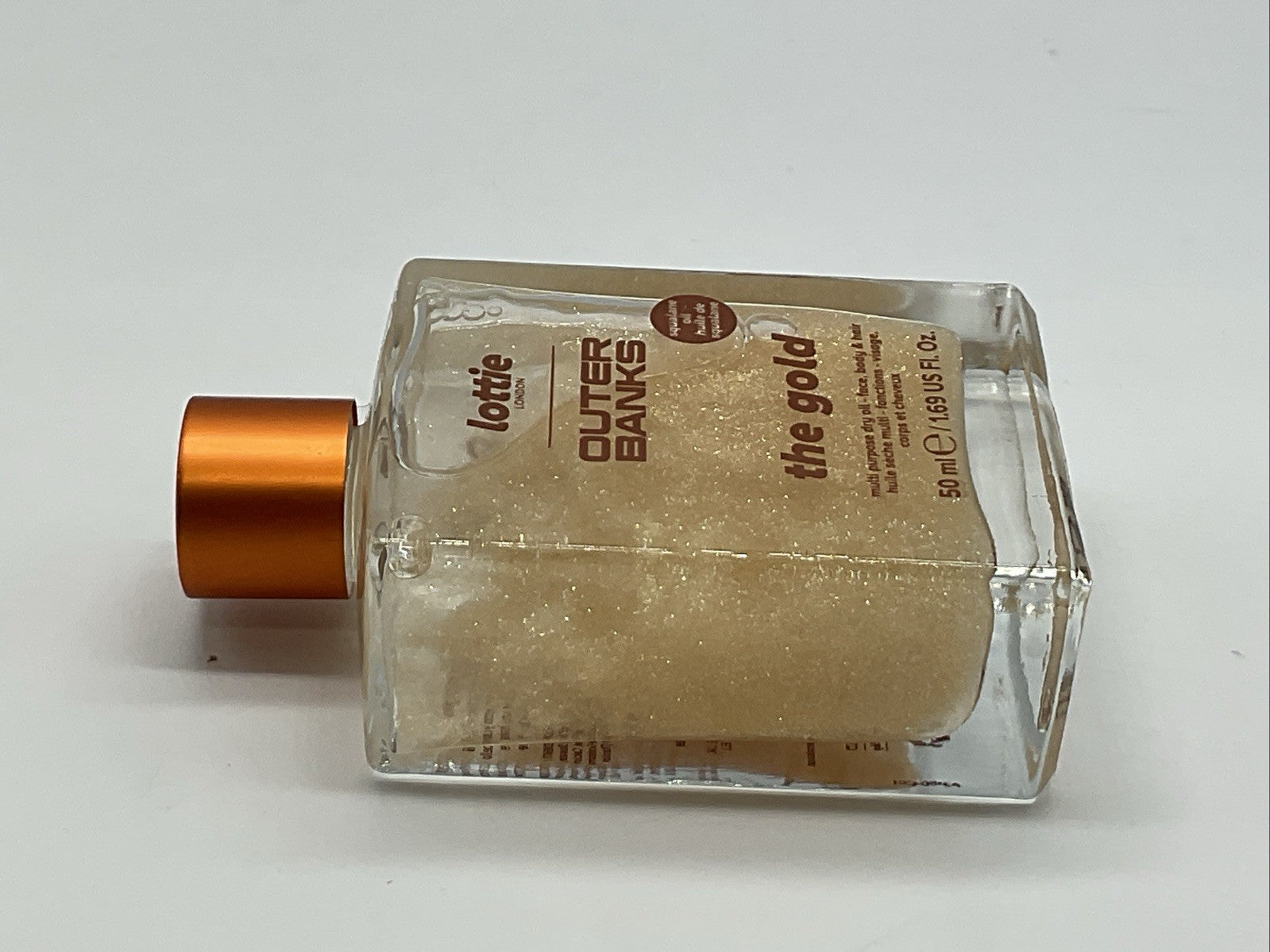 Lottie London X Outer Banks Body Illuminating Dry Oil - The Gold